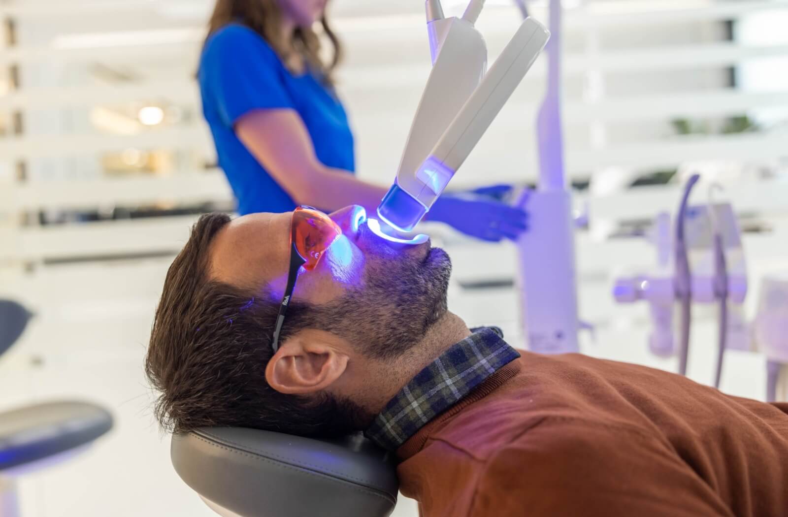 A patient undergoes a professional, in-clinic teeth whitening session.